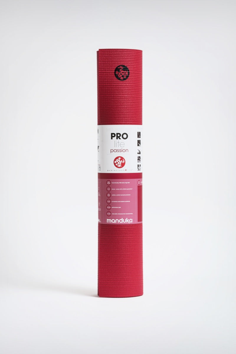 SEA YOGI // Prolite mat, 5mm thick and in Passion red style by Manduka, standing image