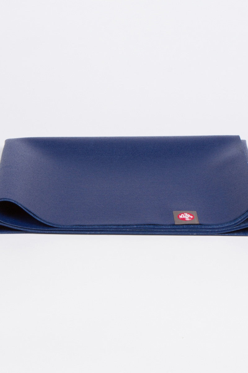 MANDUKA EKO SUPERLITE TRAVEL YOGA MAT IN  NEW MOON AND FOLDED UP IMAGE