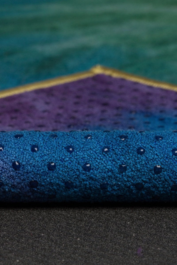 MANDUKA YOGITOES SKIDLESS MAT TOWEL IN PEACOCK STYLE AND FABRIC CLOSE UP